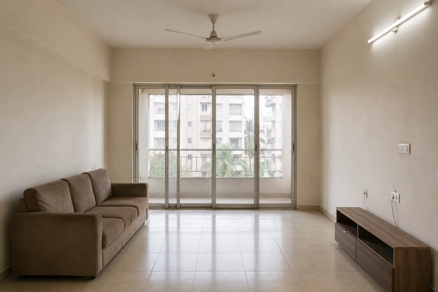 Bare living room before curtains and flooring installation